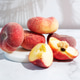 Pile of organic fig peaches with vibrant colors on a white background. Pile of organic fig peaches with vibrant colors on a white background. - PhotoDune Item for Sale