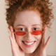 Young adult woman smiling and holding stylish sunglasses Young adult woman smiling and holding stylish sunglasses - PhotoDune Item for Sale