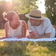 Couple having picnic in park Couple having picnic in park - PhotoDune Item for Sale