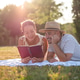 Couple having picnic in park Couple having picnic in park - PhotoDune Item for Sale