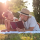 Couple having picnic in park Couple having picnic in park - PhotoDune Item for Sale