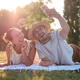 Couple having picnic in park Couple having picnic in park - PhotoDune Item for Sale