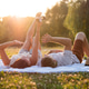 Couple enjoys sunset in park Couple enjoys sunset in park - PhotoDune Item for Sale