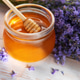 Honey jar and lavender bouquet on wooden background Honey jar and lavender bouquet on wooden background - PhotoDune Item for Sale