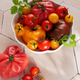 Fresh organic heirloom tomatoes in white bowl Fresh organic heirloom tomatoes in white bowl - PhotoDune Item for Sale