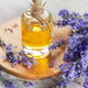Lavender essential oil bottle with fresh flowers Lavender essential oil bottle with fresh flowers - PhotoDune Item for Sale