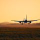Silhouette of Commercial Airplane Landing on Airport Runway at Dusk Silhouette of Commercial Airplane Landing on Airport Runway at Dusk - PhotoDune Item for Sale