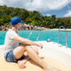 Tourist Sitting on Bow of Speedboat Approaching Anse Lazio Beach Seychelles Tourist Sitting on Bow of Speedboat Approaching Anse Lazio Beach Seychelles - PhotoDune Item for Sale