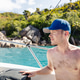 Shirtless Man with Cap in Speedboat Cruising Coastline of Praslin Island Seychelles Shirtless Man with Cap in Speedboat Cruising Coastline of Praslin Island Seychelles - PhotoDune Item for Sale