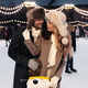 Couple of lovers hugging on the ice rink outdoors in winter time. Christmas sport leisure holidays. Couple of lovers hugging on the ice rink outdoors in winter time. Christmas sport leisure holidays. - PhotoDune Item for Sale