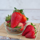 Fresh red strawberries in a clear glass bowl Fresh red strawberries in a clear glass bowl - PhotoDune Item for Sale