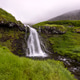 Serene Mountain Waterfall in Faroe Islands Serene Mountain Waterfall in Faroe Islands - PhotoDune Item for Sale