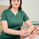 Caucasian female in green medical uniform at examination room Caucasian female in green medical uniform at examination room - PhotoDune Item for Sale