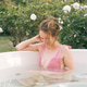 Woman relaxing in outdoor hot tub enjoying nature Woman relaxing in outdoor hot tub enjoying nature - PhotoDune Item for Sale