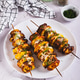 Sulvaki made from meat and potatoes on skewers on a plate on the table vertical view Sulvaki made from meat and potatoes on skewers on a plate on the table vertical view - PhotoDune Item for Sale