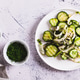 A crispy mixture of cucumbers, cabbage, onions and sesame seeds on a plate on the table top view web A crispy mixture of cucumbers, cabbage, onions and sesame seeds on a plate on the table top view web - PhotoDune Item for Sale