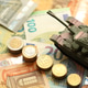Many euro banknotes and tank. Lot of bills of European union currency and green tank Many euro banknotes and tank. Lot of bills of European union currency and green tank - PhotoDune Item for Sale