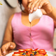 Young woman pouring sweet syrup on healthy berry waffle Young woman pouring sweet syrup on healthy berry waffle - PhotoDune Item for Sale