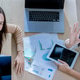 Team of partners Asian business woman discussing project on laptop sitting at table in office. Two Team of partners Asian business woman discussing project on laptop sitting at table in office. Two - PhotoDune Item for Sale