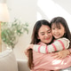 Asian mother and daughter hug on sofa at home Asian mother and daughter hug on sofa at home - PhotoDune Item for Sale