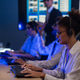 Customer service team monitors computers in night control room Customer service team monitors computers in night control room - PhotoDune Item for Sale