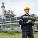 Petrochemical engineer inspects refinery pipelines with tablet Petrochemical engineer inspects refinery pipelines with tablet - PhotoDune Item for Sale