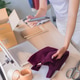 Young Asian woman online merchant scanning package with smartphone while preparing orders with lapto Young Asian woman online merchant scanning package with smartphone while preparing orders with lapto - PhotoDune Item for Sale