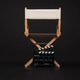 A director’s chair with a white canvas on black background. Clapperboard placed in front. A director’s chair with a white canvas on black background. Clapperboard placed in front. - PhotoDune Item for Sale