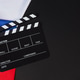 Clapper board and French flag on black background Clapper board and French flag on black background - PhotoDune Item for Sale