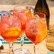Three Glasses Or Refreshing Orange Spritz Cocktails With Ice And Citrus Slices Served Outdoor Patio Three Glasses Or Refreshing Orange Spritz Cocktails With Ice And Citrus Slices Served Outdoor Patio - PhotoDune Item for Sale