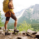 Female legs in hiking boots on hiking trail, on top of mountain outdoors. Nature, relaxation concept Female legs in hiking boots on hiking trail, on top of mountain outdoors. Nature, relaxation concept - PhotoDune Item for Sale