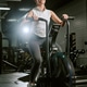 Female Athlete Training on Air Bike in Gym for Cardio Fitness Female Athlete Training on Air Bike in Gym for Cardio Fitness - PhotoDune Item for Sale