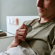 Young Man Recovering in Military Hospital Holding Dog Tags Young Man Recovering in Military Hospital Holding Dog Tags - PhotoDune Item for Sale