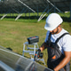 Indian worker installing solar panels. Concept of alternative, renewable energy Indian worker installing solar panels. Concept of alternative, renewable energy - PhotoDune Item for Sale