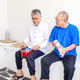 Two Joyful Elderly Indonesian Men Sitting on White Bench, Playing Small Drum and Tambourine Together Two Joyful Elderly Indonesian Men Sitting on White Bench, Playing Small Drum and Tambourine Together - PhotoDune Item for Sale