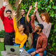Diverse group of young people celebrating success in an outdoor setting Diverse group of young people celebrating success in an outdoor setting - PhotoDune Item for Sale