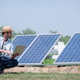 Young Farmer Using Solar Energy and Digital Technology for Sustainable Agriculture Young Farmer Using Solar Energy and Digital Technology for Sustainable Agriculture - PhotoDune Item for Sale