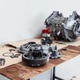 Disassembled Electric Vehicle Drive Unit Components on Workbench for Inspection and Repair Disassembled Electric Vehicle Drive Unit Components on Workbench for Inspection and Repair - PhotoDune Item for Sale