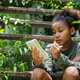 Young Eco Traveler Exploring Biodiversity Through Sustainable Tourism Young Eco Traveler Exploring Biodiversity Through Sustainable Tourism - PhotoDune Item for Sale