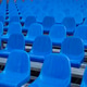 Geometric perspective of empty blue plastic seats. Geometric perspective of empty blue plastic seats. - PhotoDune Item for Sale