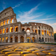 The Colosseum illuminated at sunset with cobblestone foreground. The Colosseum illuminated at sunset with cobblestone foreground. - PhotoDune Item for Sale
