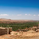 Spectacular high-angle panoramic view of the lush palm grove oasis and mountains in Tinghir. Spectacular high-angle panoramic view of the lush palm grove oasis and mountains in Tinghir. - PhotoDune Item for Sale