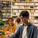 Young man reading open book at library study table for self study session Young man reading open book at library study table for self study session - PhotoDune Item for Sale
