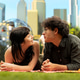 Young couple laying face to face and smiling at each other on picnic blanket Young couple laying face to face and smiling at each other on picnic blanket - PhotoDune Item for Sale