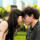 Young couple touching foreheads with intimate gaze on picnic blanket Young couple touching foreheads with intimate gaze on picnic blanket - PhotoDune Item for Sale