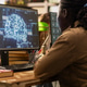 Young adult studying glowing AI brain interface on desktop monitor Young adult studying glowing AI brain interface on desktop monitor - PhotoDune Item for Sale