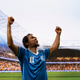 African american soccer player in blue jersey raising arms and saluting fans African american soccer player in blue jersey raising arms and saluting fans - PhotoDune Item for Sale