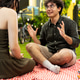 Young couple sitting and talking on romantic picnic date together Young couple sitting and talking on romantic picnic date together - PhotoDune Item for Sale