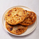 Salvadoran pupusas on white plate, light background. Traditional Salvadoran corn flatbread Salvadoran pupusas on white plate, light background. Traditional Salvadoran corn flatbread - PhotoDune Item for Sale