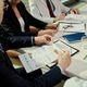 Senior Business Team Reviewing Financial Reports in Meeting Senior Business Team Reviewing Financial Reports in Meeting - PhotoDune Item for Sale